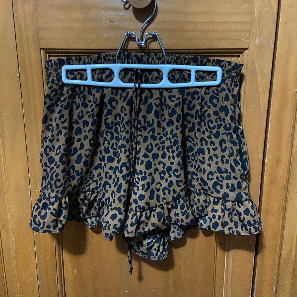 Sienna Sky dress shorts with pockets, false (style) front strings.